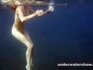 Cute Nastya swimming nude in the sea